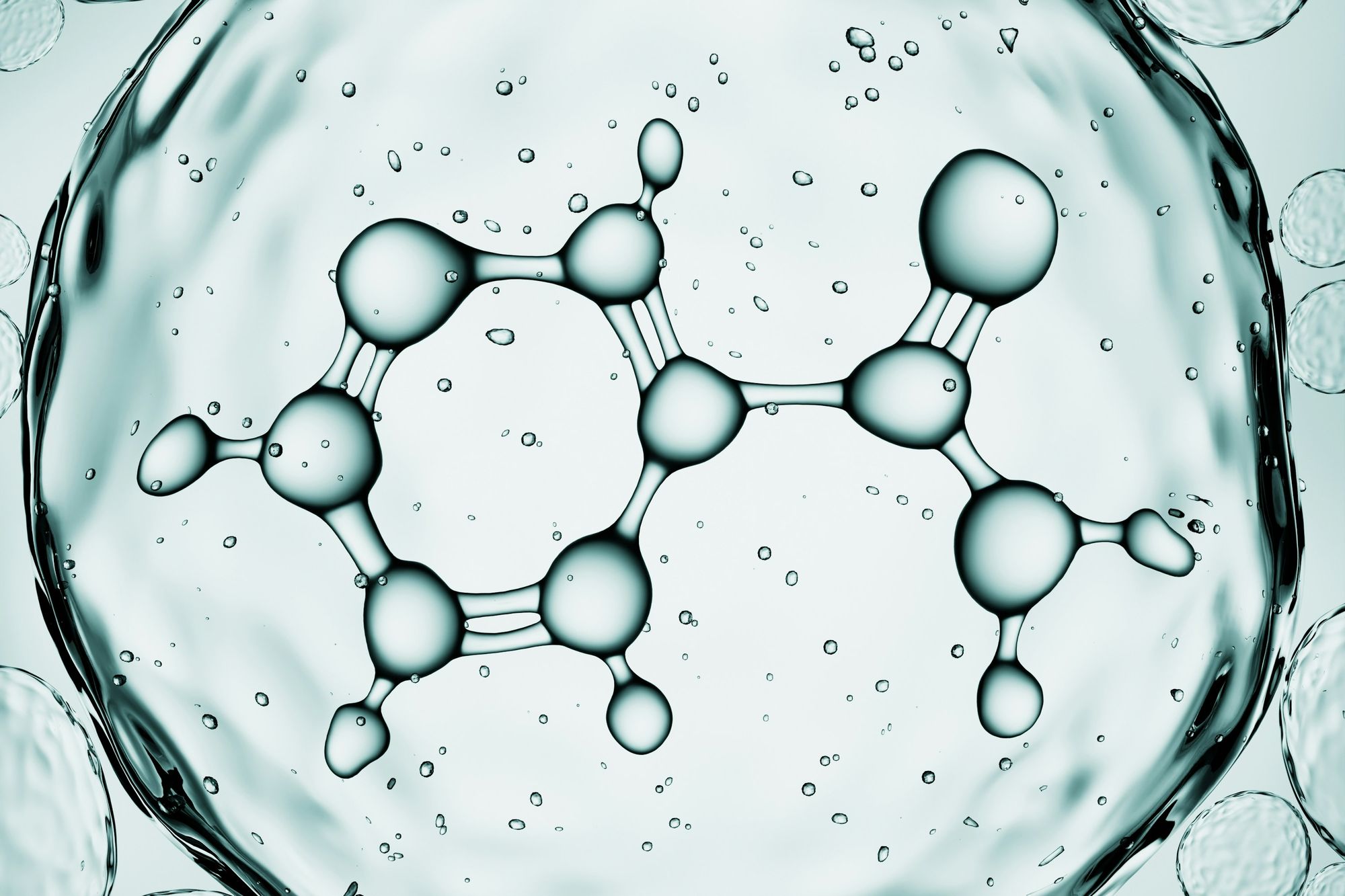 Commercial aircraft wing seen from the cabin window above clouds at altitude — the view that frames aviation's energy transition challenge: long-range flight at scale, powered by a fuel mix yet to be determined for 2050