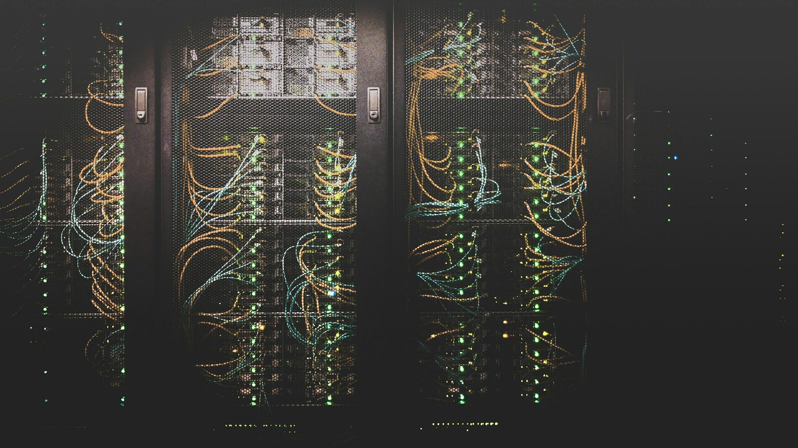 Fibre-optic strands carrying light — the physical substrate of AI's next infrastructure leg