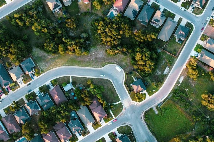 Overhead view of a suburban subdivision of cul-de-sacs and detached houses
